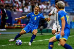 Three Dynamo players perform for Ukraine against Iraq at the Olympic Games